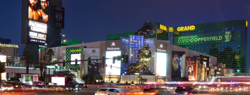 MGM Grand at night with traffic light trails