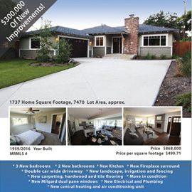 Single-story ranch home with driveway and chimney