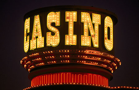 Illuminated casino marquee sign with bulbs