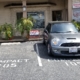 Gray Mini Cooper parked in compact parking spot
