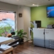 Print shop interior with large printers and plants