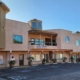 Tan two-story commercial office building facade