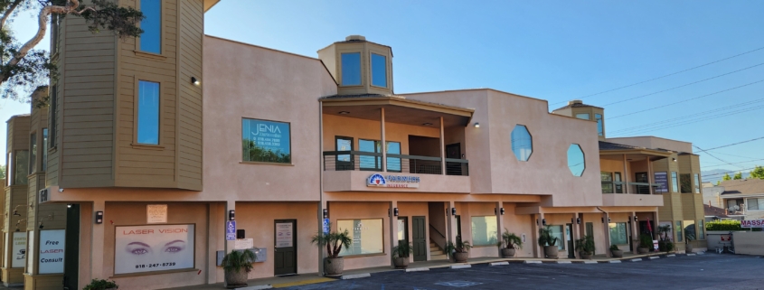 Tan two-story commercial office building facade