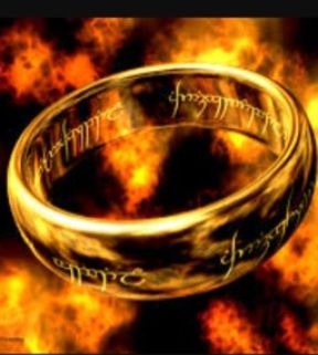 Gold ring with Elvish inscription amid flames