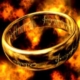Gold ring with Elvish inscription amid flames