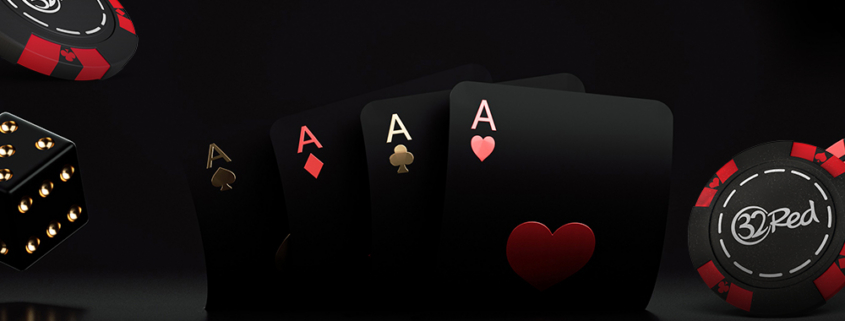 Four poker aces with chips and dice