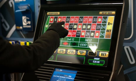 Gloved hand selecting bet on electronic roulette screen