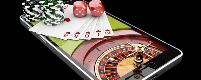 Mobile casino concept with cards, chips, roulette