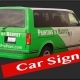 Green van with "Printing by Harvey" signage
