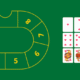Green casino layout with numbered track and cards