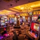 Colorful casino slot machines under chandeliers