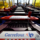 Row of Carrefour shopping carts at entrance
