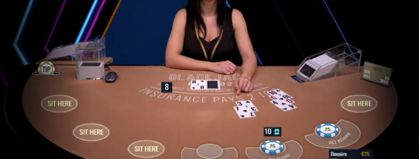 Live casino dealer at blackjack table