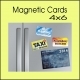 Fridge displaying various promotional magnetic cards