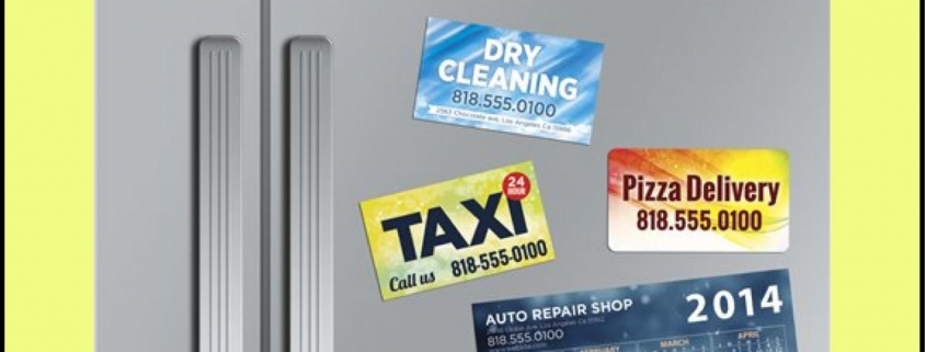 Fridge displaying various promotional magnetic cards