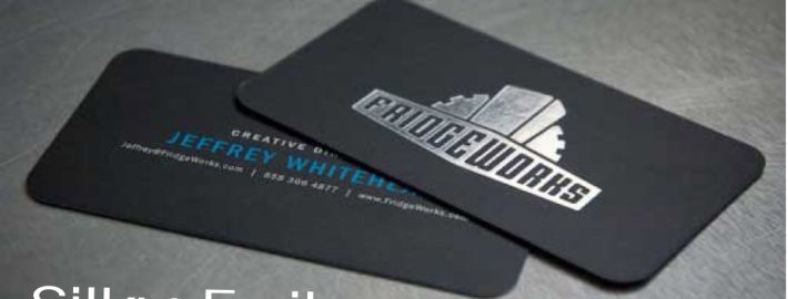 Black foil-stamped business cards with logo
