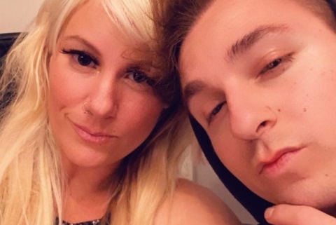 Close-up selfie of blonde woman and man