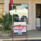 Printing shop storefront with parking sign