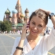 Smiling woman on phone near St. Basil's Cathedral