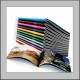 Colorful stacked glossy photo magazines