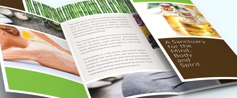 Open tri-fold spa brochure with wellness photos