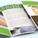 Open tri-fold spa brochure with wellness photos