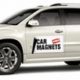 White SUV with car magnet advertisement
