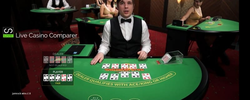 Live casino dealer at card table