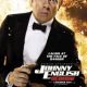 Man in tuxedo holding gun amid explosion