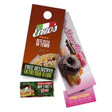 Two promotional door hangers for pizza and donuts