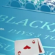Casino blackjack table with chips and playing cards