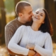 Happy couple embracing in autumn park