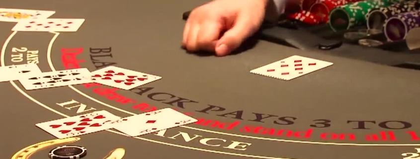 Blackjack table with dealer hand and chips