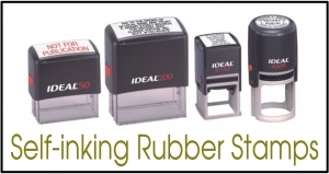 Row of four self-inking rubber stamps