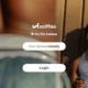 Man in tank top holding phone by wall