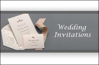 Elegant wedding invitations with ribbon and envelopes